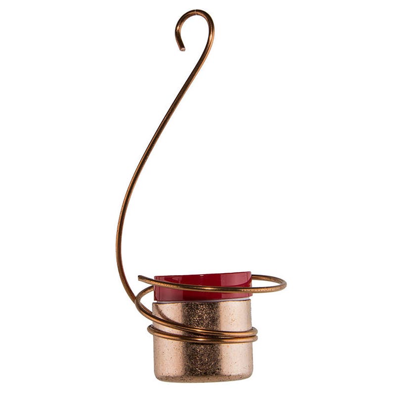Pode incluir: Um ornamento de arame de cobre com uma parte superior de cer&acirc;mica vermelha e branca. O ornamento tem um la&ccedil;o na parte superior para pendurar.
