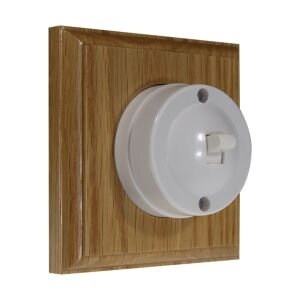 May include: White porcelain light switch with a toggle switch in a square oak wood frame.