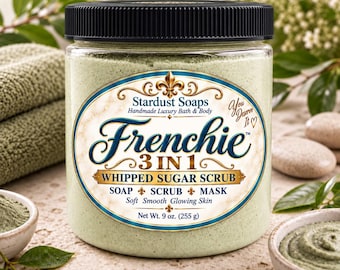 May include: A clear plastic jar with a black lid containing light green whipped sugar scrub. The label reads Stardust Soaps Frenchie 3 IN 1 WHIPPED SUGAR SCRUB SOAP SCRUB MASK Net Wt. 9 oz. (255 g) with decorative gold and blue accents.