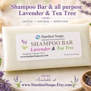 May include: A rectangular, off-white shampoo bar with a label reading Stardust Soaps Lavender & Tea Tree. The packaging features the text Shampoo Bar & all purpose Lavender & Tea Tree, Gentle, Natural, Effective, and a net weight of 113.4 g.