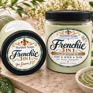 May include: Two clear plastic jars with black lids containing light green whipped sugar scrub. The labels read Stardust Soaps Frenchie 3 in 1 Whipped Sugar Scrub, Soap, Scrub, Mask, Soft, Smooth, Glowing Skin, Net Wt. 9 oz. (255 g), and You Deserve It.