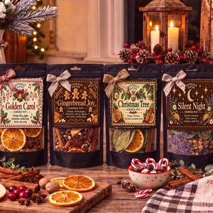 May include: Six black pouches of simmer pot ingredients labeled Winter Wonderland, Golden Carol, Gingerbread Joy, Christmas Tree, Silent Night, and Santa's Sack, each tied with a small bow and containing dried fruits, spices, and botanicals.
