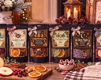 May include: Six black pouches of simmer pot ingredients labeled Winter Wonderland, Golden Carol, Gingerbread Joy, Christmas Tree, Silent Night, and Santa's Sack, each tied with a small bow and containing dried fruits, spices, and botanicals.
