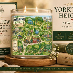 May include: A clear glass jar candle with two wicks, featuring a colorful illustrated map of Yorktown Heights, New York on the label. The candle is presented with its matching box, which displays the text Yorktown Heights New York, 13 oz, 368 g.