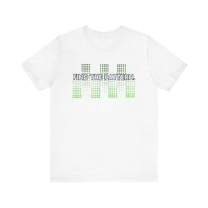 May include: White t-shirt with a green and white pixelated design that says "FIND THE PATTERN."