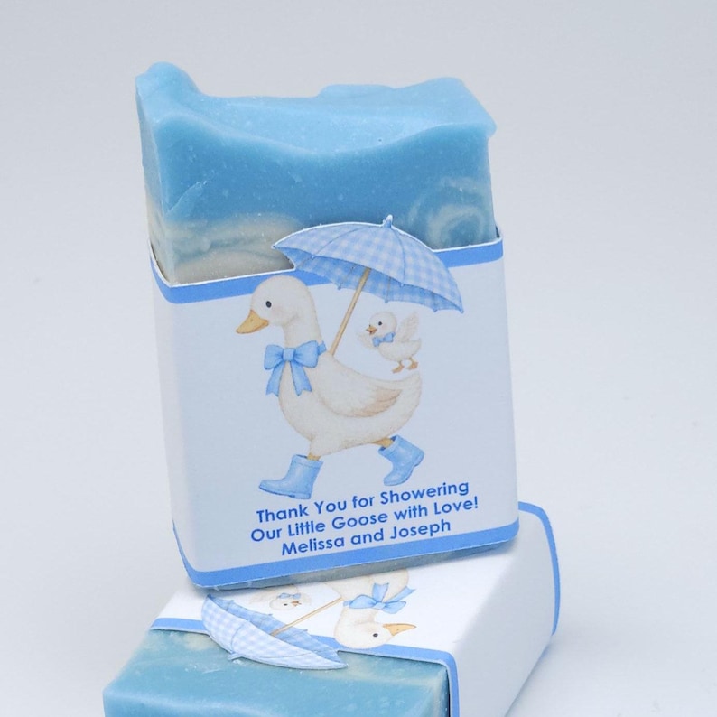Blue silly goose baby shower soap favor featuring a handmade blue soap bar with a matching goose design label, displayed on a clean white background