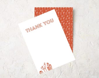 May include: A white card with the text "THANK YOU" in orange. The card has a cactus illustration in the bottom corner and a red background with a white cactus pattern.