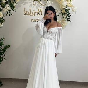 Thin Strap Lace V-Neck Wedding Dress, Lush Sleeve Bridal Gown, Elegant Romantic Design, Geometric Lace Detail, Light and Airy