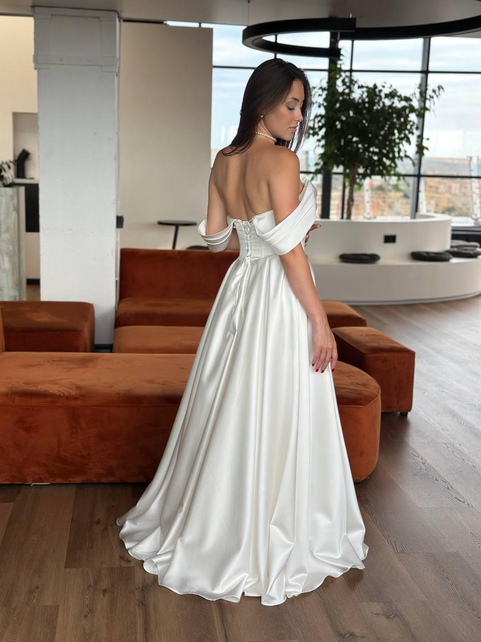 Ivory Off-Shoulder Satin Wedding Dress, A-Line Gown with Corset and Draping Sleeves, No Train Bridal Look, Minimalist Bride Dress Ivory Off-Shoulder Satin Wedding Dress, A-Line Gown with Corset and Draping Sleeves, No Train Bridal Look, Minimalist Bride Dress