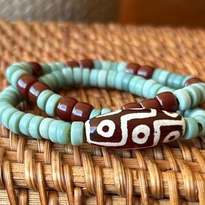 Green and Brown Java Glass Bracelets, Evil Eye Tibetan Focal Bead Set of Two, Pistachio Green Beads, Matte and Shiny Finishes, Spiritual Set