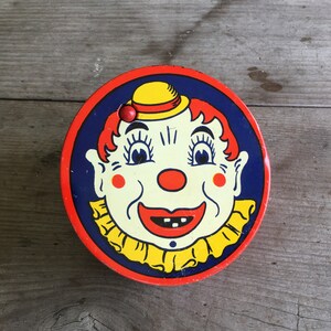 Antique Clown Litho Kirchhof Noise Maker Round Ratchet Style w/ Wooden Handle Ca. 1940s image 1
