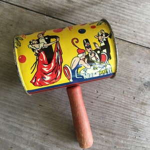 Antique Litho Noise Maker Metal Tin Can Mallet Rattle w/ Wooden Handle Ca. 1930s image 1