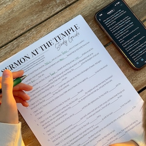 May include: A black and white printable study guide with the title "Sermon at the Temple" and a list of questions and scripture references. The guide is on a wooden table with a phone displaying a digital Bible.