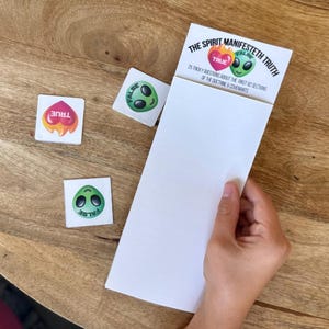 May include: A white card with the text "THE SPIRIT MANIFESTETH TRUTH" and "25 tricky questions about the first 82 sections of the doctrine & covenants." Three small square cards with alien graphics and the words "TRUE" and "FALSE".
