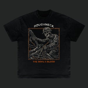 May include: Black t-shirt with a detailed illustration of a skeleton in a hard hat, holding chains. The design includes the text "ROUGHNECK" above the image and "THE DEVIL'S BLOOD" below, in orange lettering.