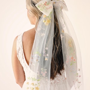 Tulle hair bow with embroidered flowers