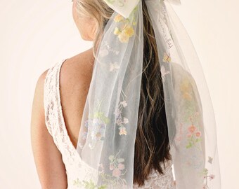 Tulle hair bow with embroidered flowers