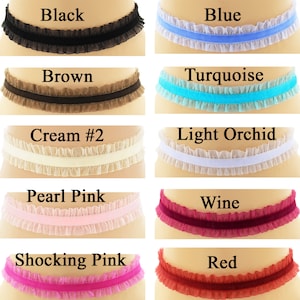 May include: Ten different colors of ruffled trim with a velvet ribbon in the center. The colors are black, blue, brown, turquoise, cream, light orchid, pearl pink, wine, shocking pink, and red.