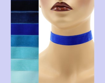 May include: A royal blue velvet choker necklace. The choker is made of a soft, luxurious velvet fabric and is adjustable to fit most neck sizes.