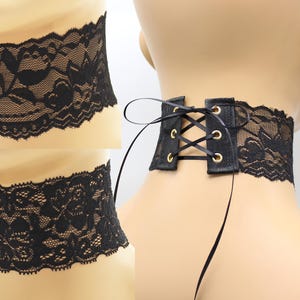 May include: Black lace corset belt with a lace-up back and gold eyelets.