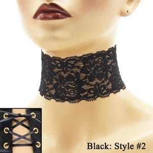May include: Black lace choker necklace with a delicate floral pattern. The choker is worn on a mannequin's neck. "Black: Style #2" is written below the choker.