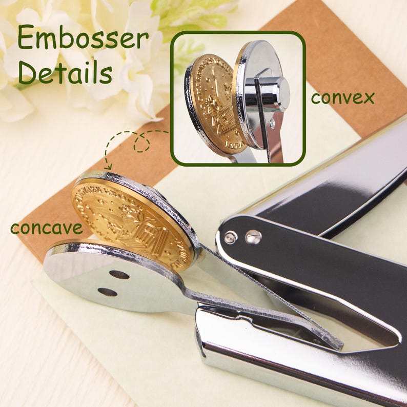 May include: A silver embosser with a gold-colored seal. The seal is labeled "concave" and "convex" to show the two sides of the seal. The embosser is used to create raised lettering or designs on paper or other materials.