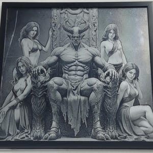 May include: Black framed artwork featuring a detailed grayscale illustration. A muscular horned figure sits on a throne, surrounded by four women. The artwork has a fantasy theme, with intricate details and shading.