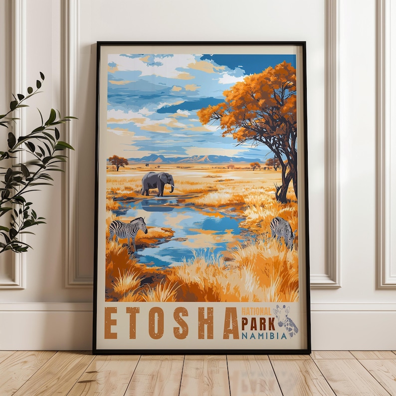 A framed poster of Etosha, Namibia, showcasing a picturesque savannah scene. It features zebras grazing, an elephant near a reflective waterhole, and a striking orange acacia tree under a dramatic, cloud-filled sky with distant mountains.