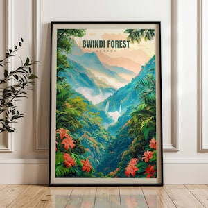May include: A framed vertical wall art print titled Bwindi Forest Uganda, featuring a lush tropical landscape with dense green foliage, vibrant orange flowers, misty blue mountains, and a cascading waterfall under a soft peach-colored sky.