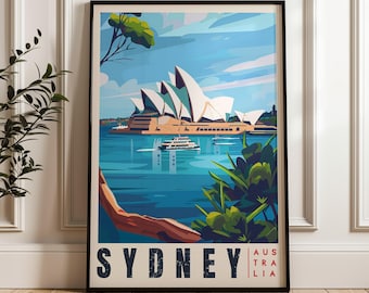 May include: A framed vertical travel poster featuring a stylized illustration of the Sydney Opera House in white against a blue harbor. A boat travels on the water, with green foliage in the foreground. The text SYDNEY AUSTRALIA appears at the bottom.
