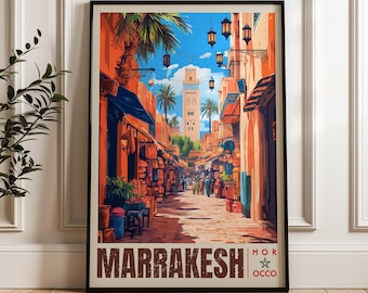 May include: A framed travel poster depicting a vibrant Marrakesh street scene with orange buildings, hanging lanterns, palm trees, and a central minaret under a blue sky. The text MARRAKESH MOR OCCO with a green star is printed at the bottom.