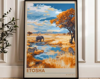 May include: A framed art print featuring a landscape of Etosha, Namibia. The scene depicts a watering hole with an elephant and two zebras amidst golden grasses and a large orange-leafed tree under a blue sky with white clouds. Text reads ETOSHA NAMIBIA.