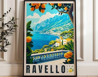 May include: A framed travel poster of Ravello, Italy, featuring a coastal view with a blue sea, mountains, and a stone balustrade in the foreground. Orange trees with fruit frame the scene. The text RAVELLO ITALY is printed at the bottom.