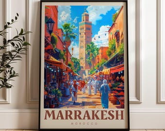 May include: A framed vertical art print depicting a bustling Marrakesh street market scene with terracotta-colored buildings, a tall minaret tower, palm trees, and people in traditional clothing. The text MARRAKESH MOROCCO is printed at the bottom.