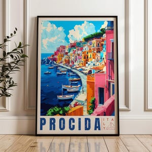 May include: A framed travel poster featuring a vibrant illustration of Procida, Italy. The artwork displays colourful buildings along a coastline, a deep blue harbour filled with small boats, and a bright sky. The text PROCIDA ITALY is at the bottom.