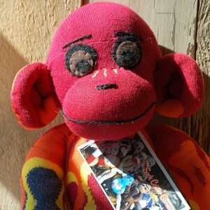 Mono calcetín de llama de fuego