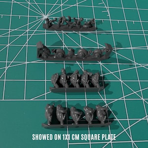 May include: Gray plastic miniature figurines of various creatures, including snails, turtles, and other animals, are arranged on a green grid. The text "SHOWED ON 1X1 CM SQUARE PLATE" is at the bottom of the image.