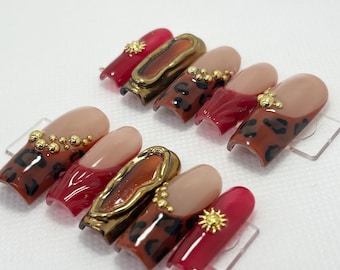 May include: Set of ten false nails with a leopard print design, gold accents, and red and nude polish.