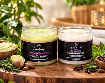 May include: Two clear plastic jars of hair butter with black labels. The left jar contains pale green Herbal Whipped Hair Butter, 100ml. The right jar contains off-white Cloves Hair Growth Butter, 100ml, with rosemary and clove accents nearby.