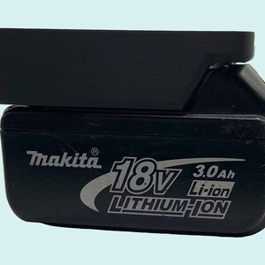 May include: A black Makita 18V 3.0Ah Li-ion Lithium-ion battery.