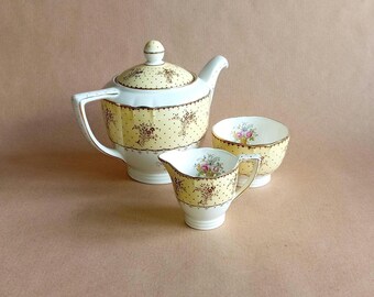 Minton &quot;Byron&quot; Pattern Yellow and White  Colour Sceme and a Gold Dotted Pattern and Floral Accents Tea Set: Teapot, Sugar Bowl and Creamer