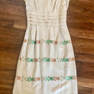 1960’s pencil dress with embroidered flowers and pleated waist