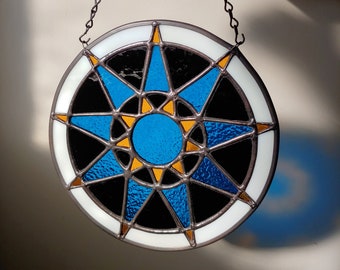 Geometric star stained glass, round sun catcher, folk blue star design