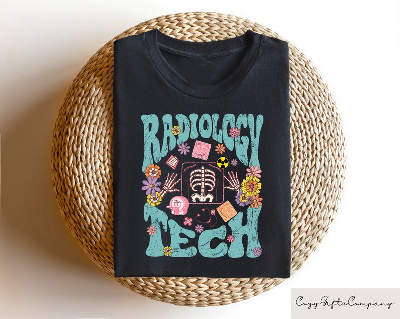May include: Black t-shirt with a teal and white graphic that says "Radiology Tech" with a stylized x-ray image and flowers.