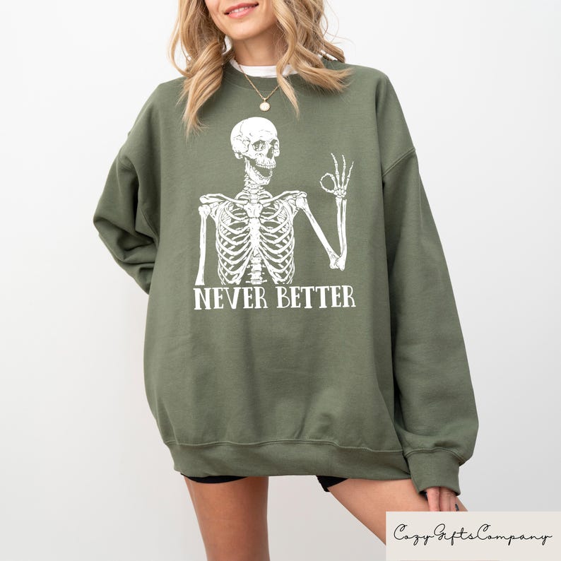 May include: Green sweatshirt with a white skeleton graphic and the text "Never Better".