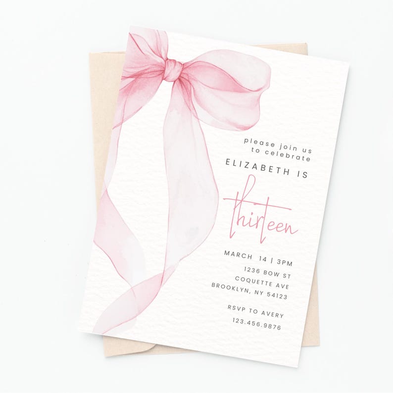 May include: Pink watercolour bow with a white background. The text "please join us to celebrate ELIZABETH IS thirteen" is printed on the invitation. The date, time, address, and RSVP information are also included.