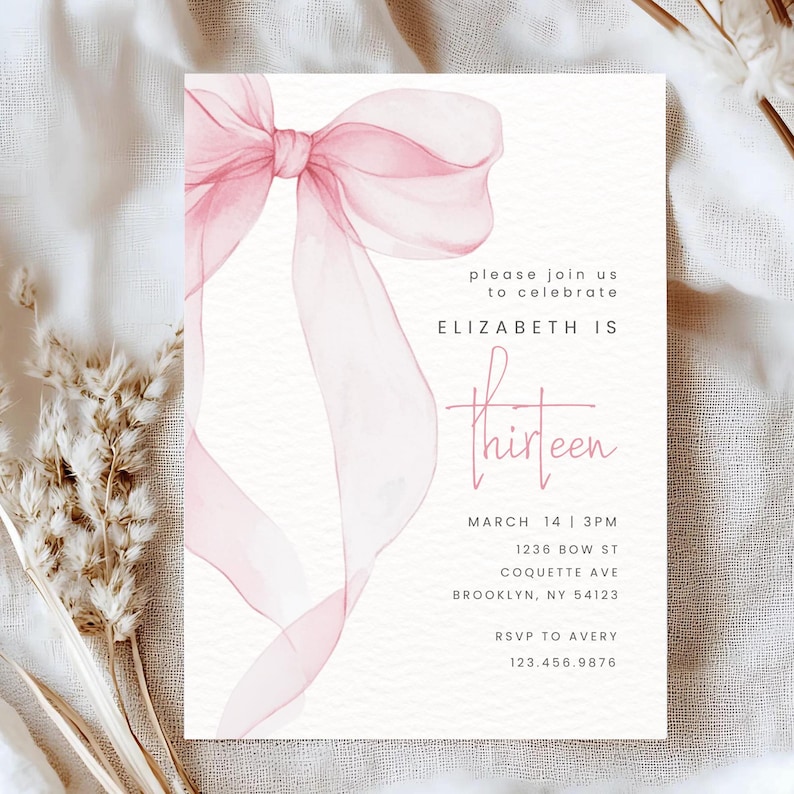 May include: A pink watercolour bow on a white background. The text "please join us to celebrate ELIZABETH IS thirteen" is printed below the bow. The date and time of the event are listed below the text, along with the address and RSVP information.