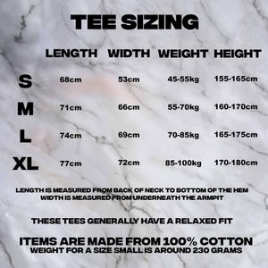 May include: A white marble background displays a black text chart titled "TEE SIZING." The chart details tee shirt measurements for sizes S, M, L, and XL, including length, width, weight, and height in centimeters and kilograms. The text also states the tees have a relaxed fit and are made from 100% cotton.