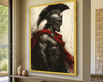 May include: A framed artwork depicts a Spartan warrior in profile, wearing a helmet and red cape. The artwork has a gold frame and is displayed in a well-lit room. The warrior's armor is detailed with a textured appearance, and the background is a mix of white and gray.