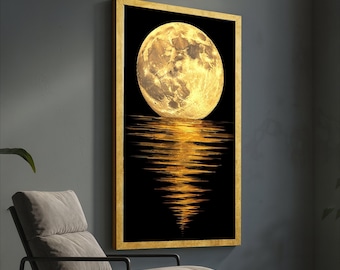 May include: A framed art print featuring a full moon reflected in water. The moon is a bright yellow-gold color, and the water reflection is a similar hue against a black background. The frame is gold.